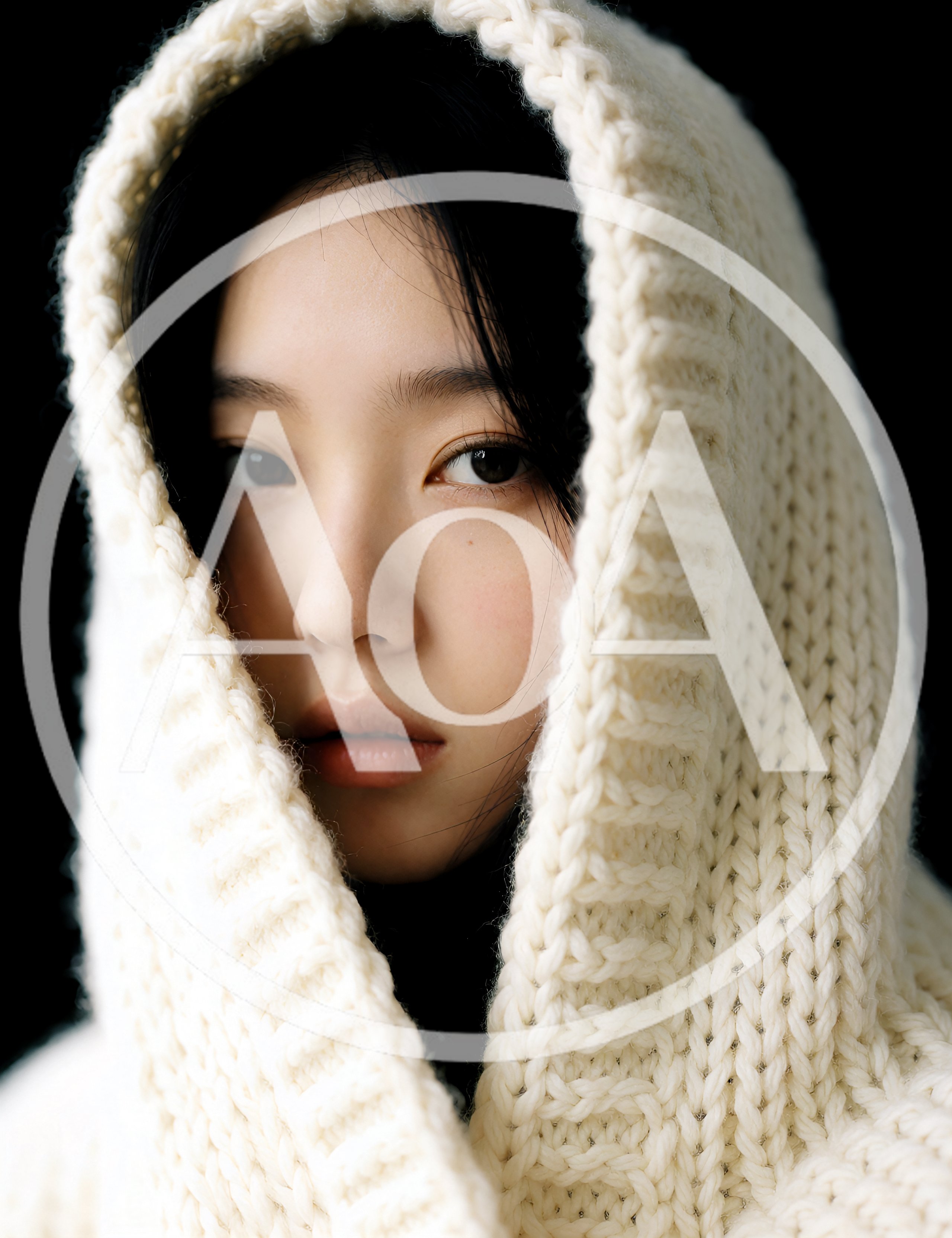 Portrait Of A Young Woman Wearing A Knitted Hood