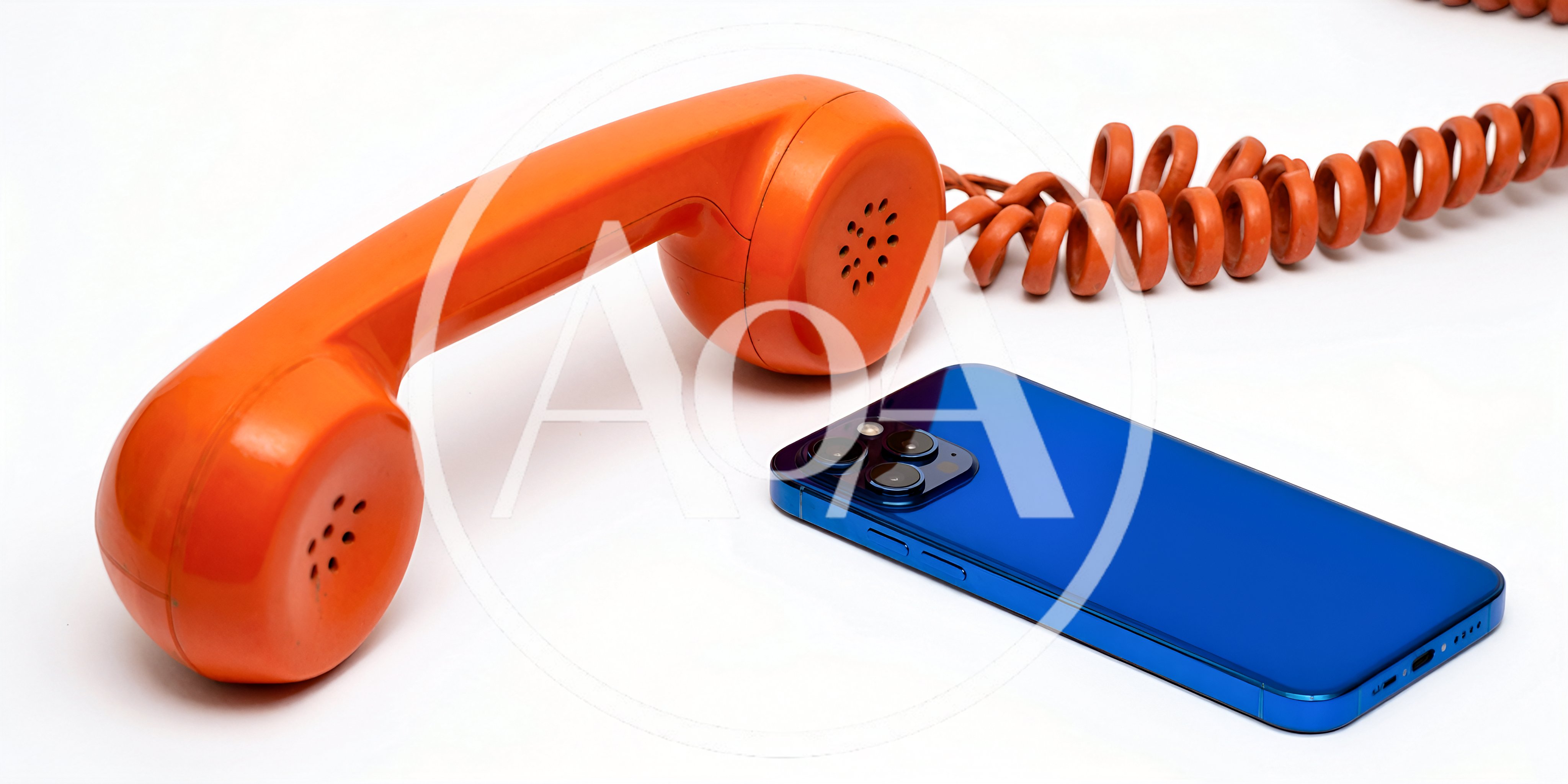 Vintage Orange Telephone Handset Beside Modern Blue Smartphone