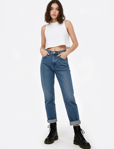Young Woman Modeling Casual White Crop Top And Jeans