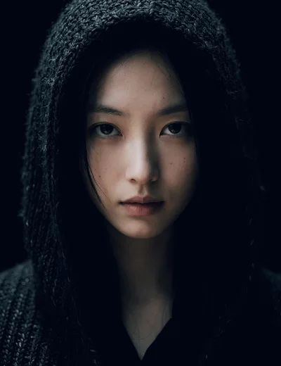Portrait Of A Young Woman In A Dark Hood