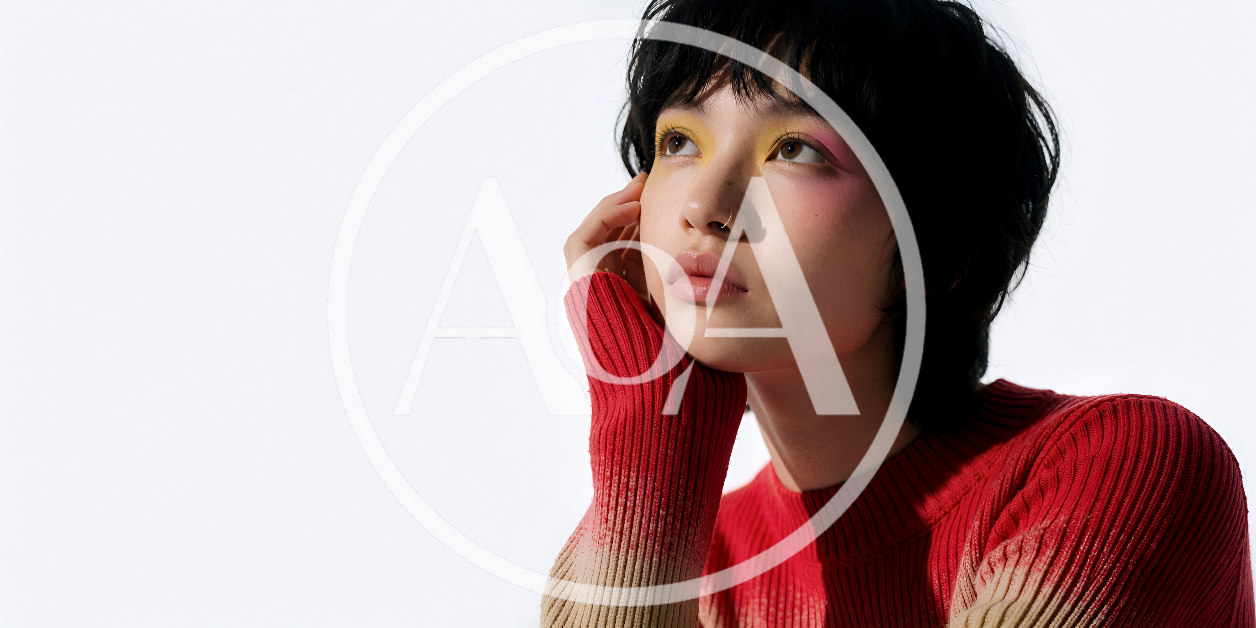 Young Woman With Artistic Makeup Posing In Red Sweater