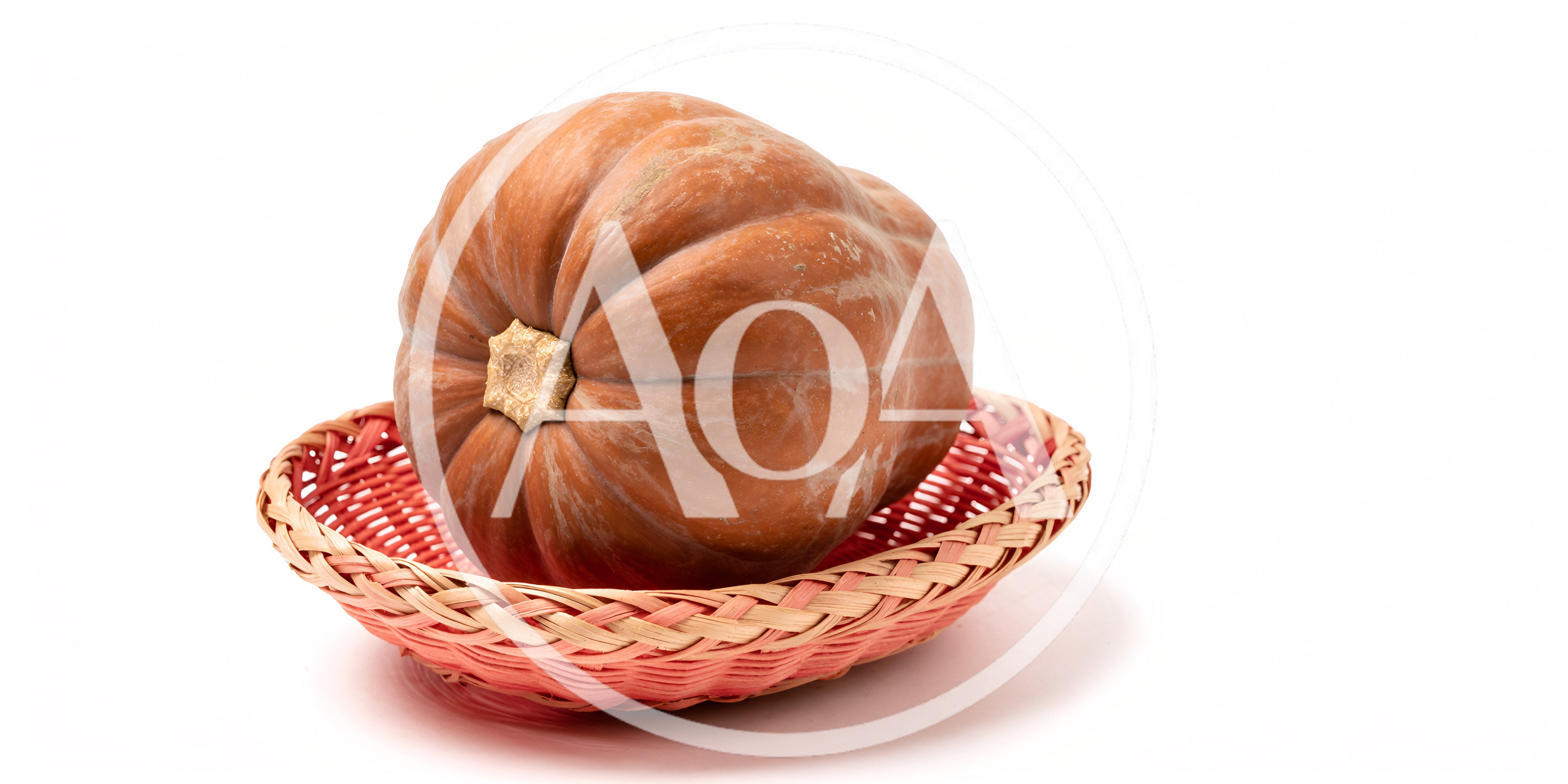 Large Orange Pumpkin Resting In A Woven Basket