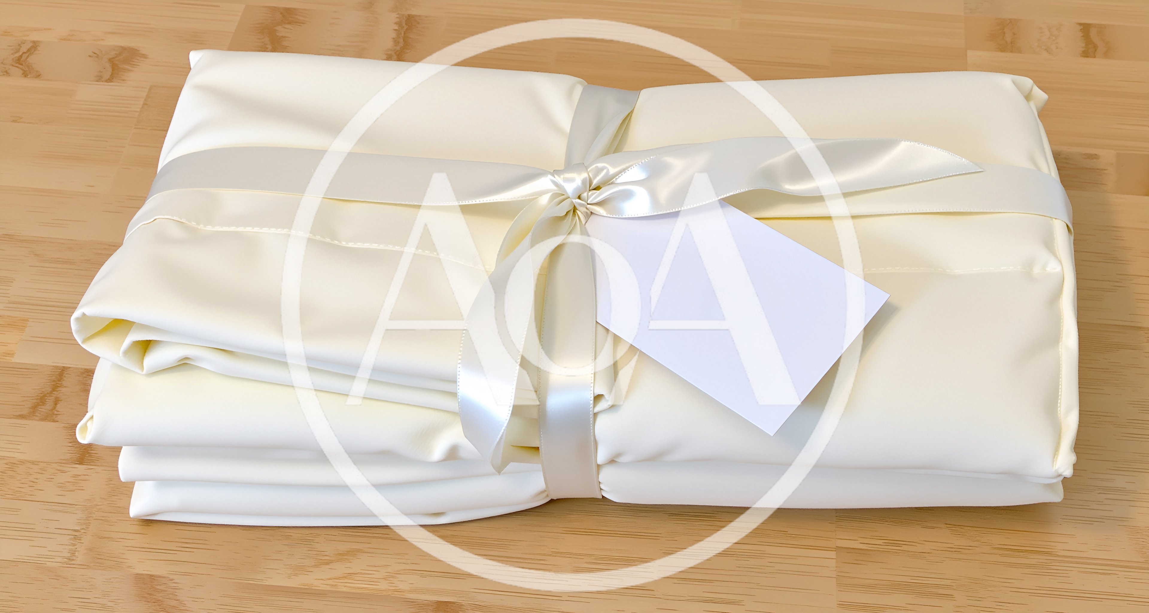 Folded Cream Bed Sheets Tied With Satin Ribbon