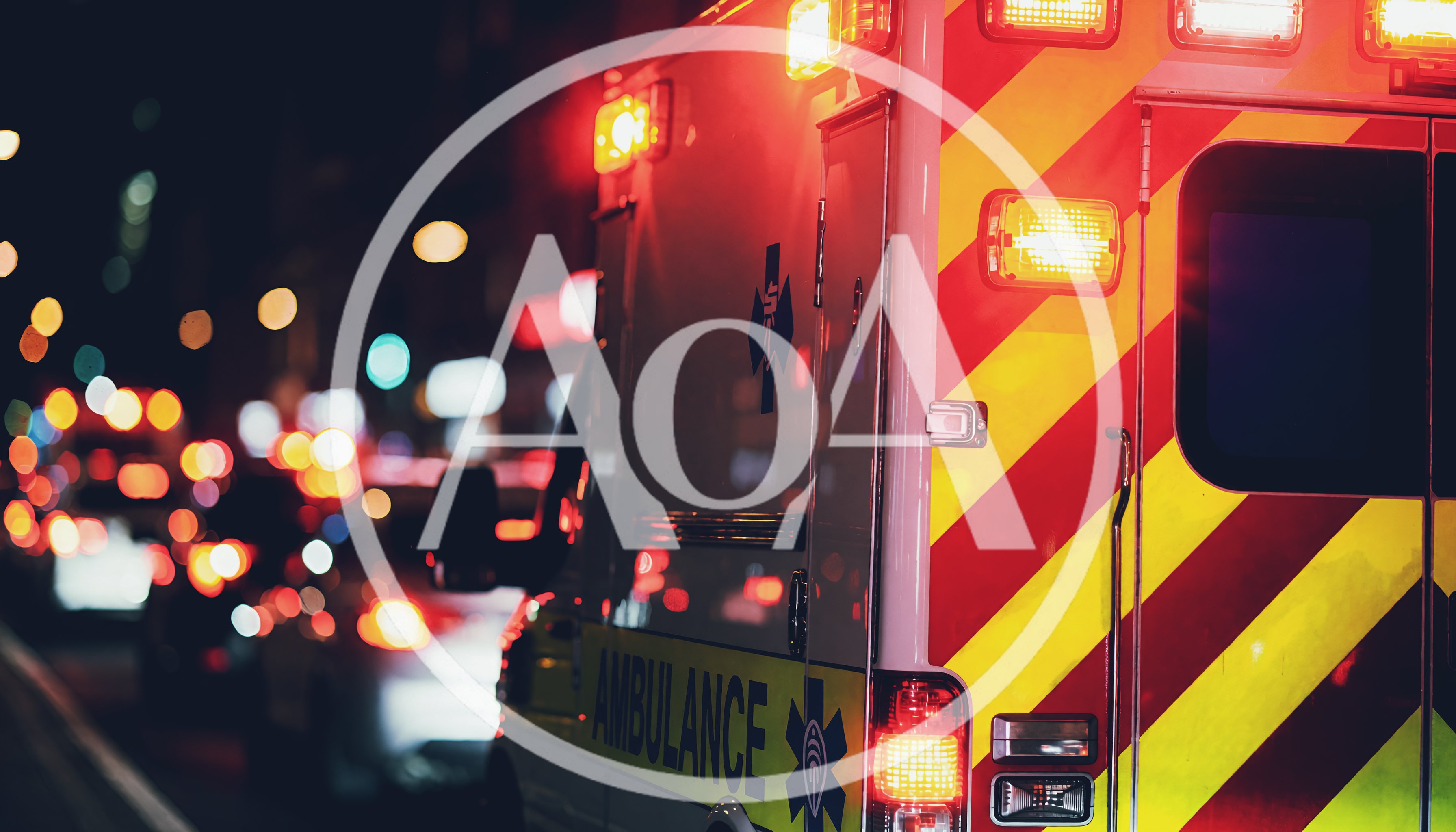 Ambulance Driving Through City Traffic At Night