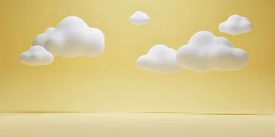 3D Rendered White Clouds Floating Against Yellow Background