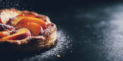Fresh Peach Tart With Powdered Sugar