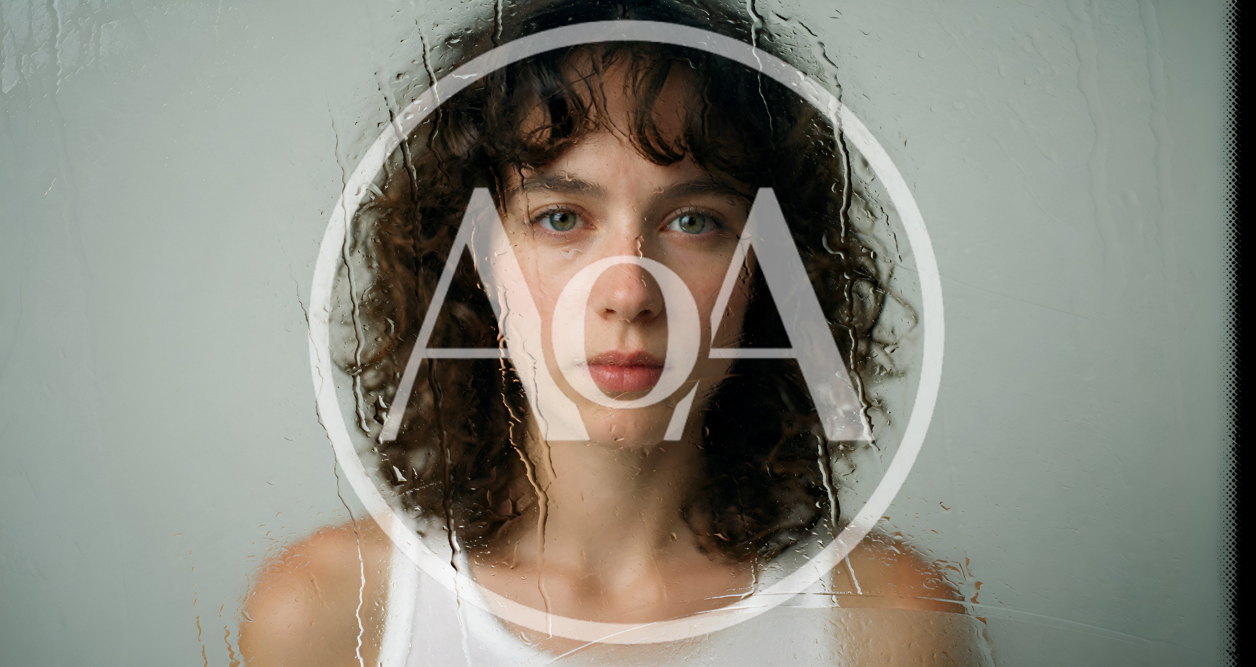 Young Woman Looking Through Rain Streaked Glass