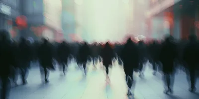 Blurred Crowd Walking Through Urban City Street