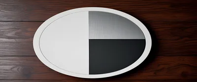 Minimalist Oval Design Object On Dark Wood Surface
