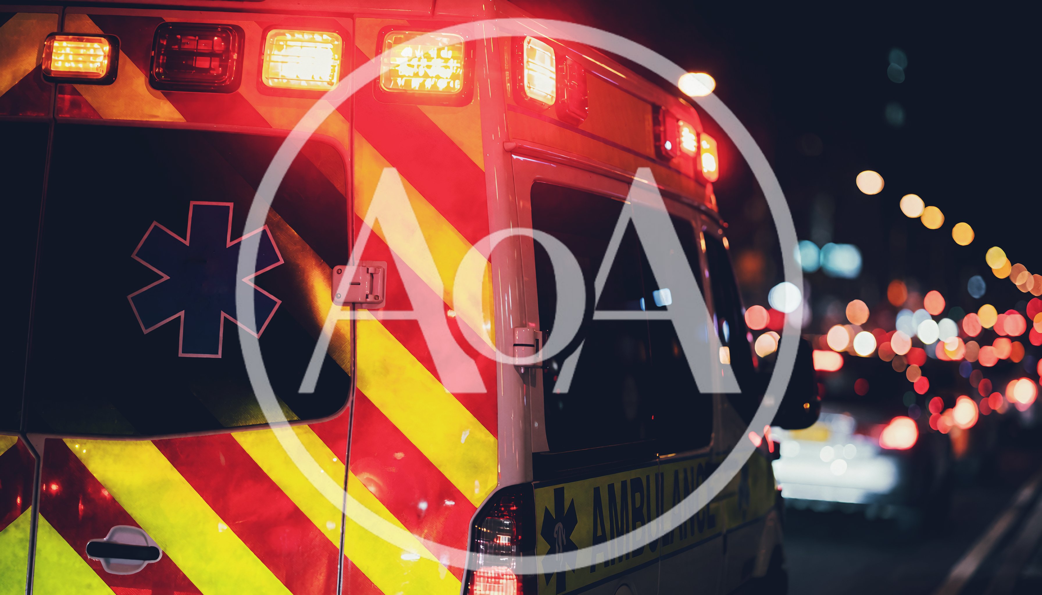 Ambulance Driving Through City Traffic At Night