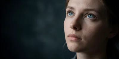 Portrait Of A Young Woman Looking Upwards