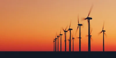 Wind Turbine Farm Silhouettes At Sunset