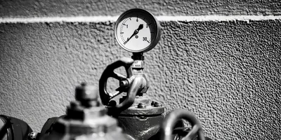 Industrial Pressure Gauge And Valve On Textured Wall
