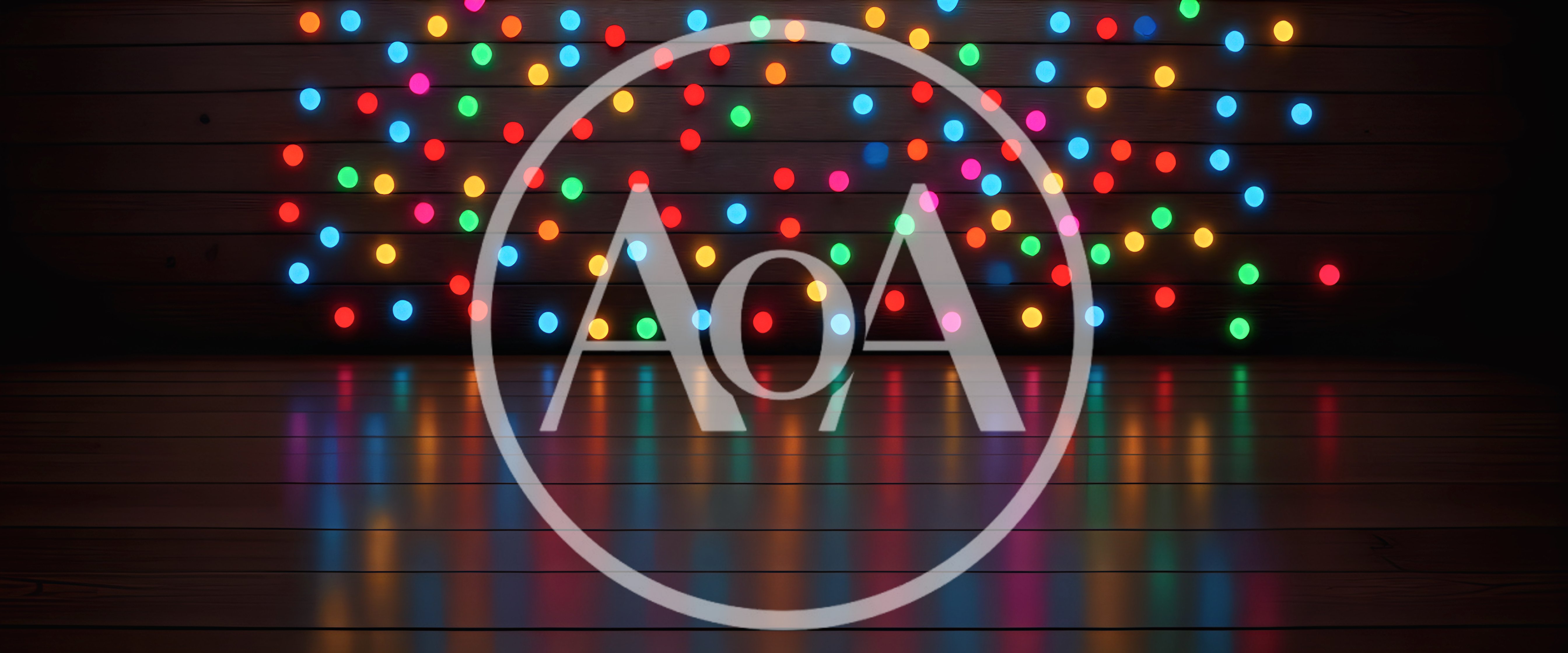 Colorful Christmas String Lights Against Dark Wooden Wall