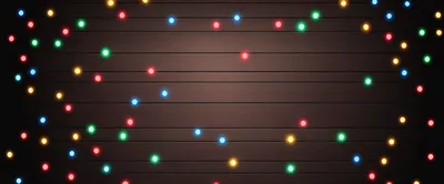 Colorful Christmas String Lights On Dark Wooden Background