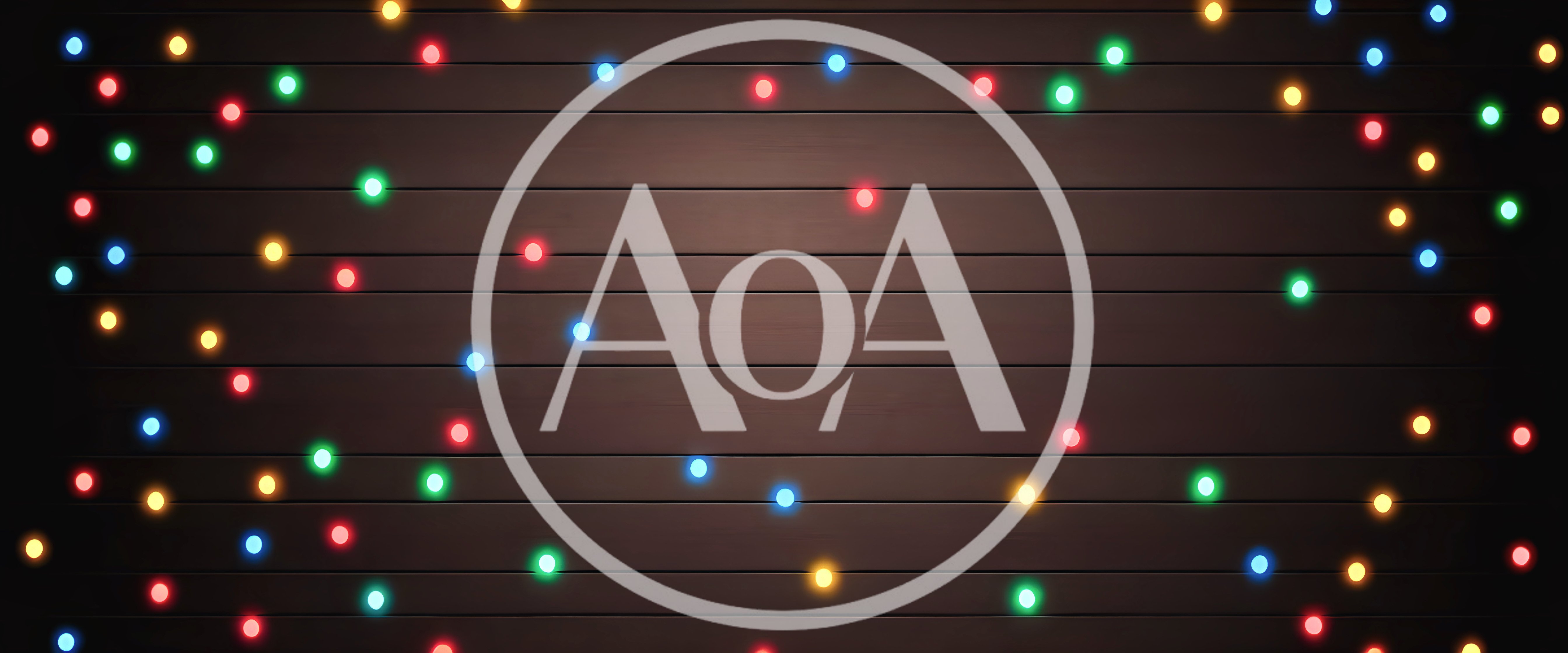 Colorful Christmas String Lights On Dark Wooden Background