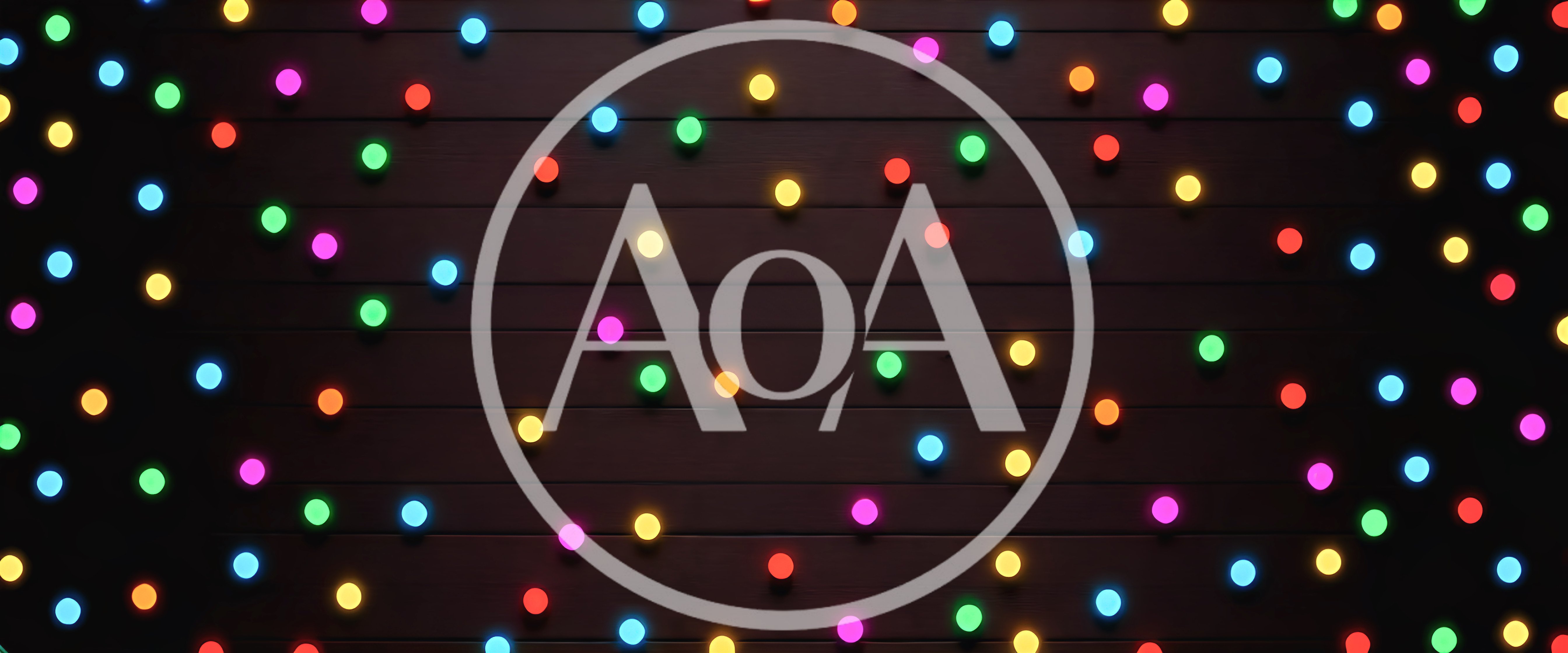 Colorful Glowing Christmas Lights On Dark Wooden Background