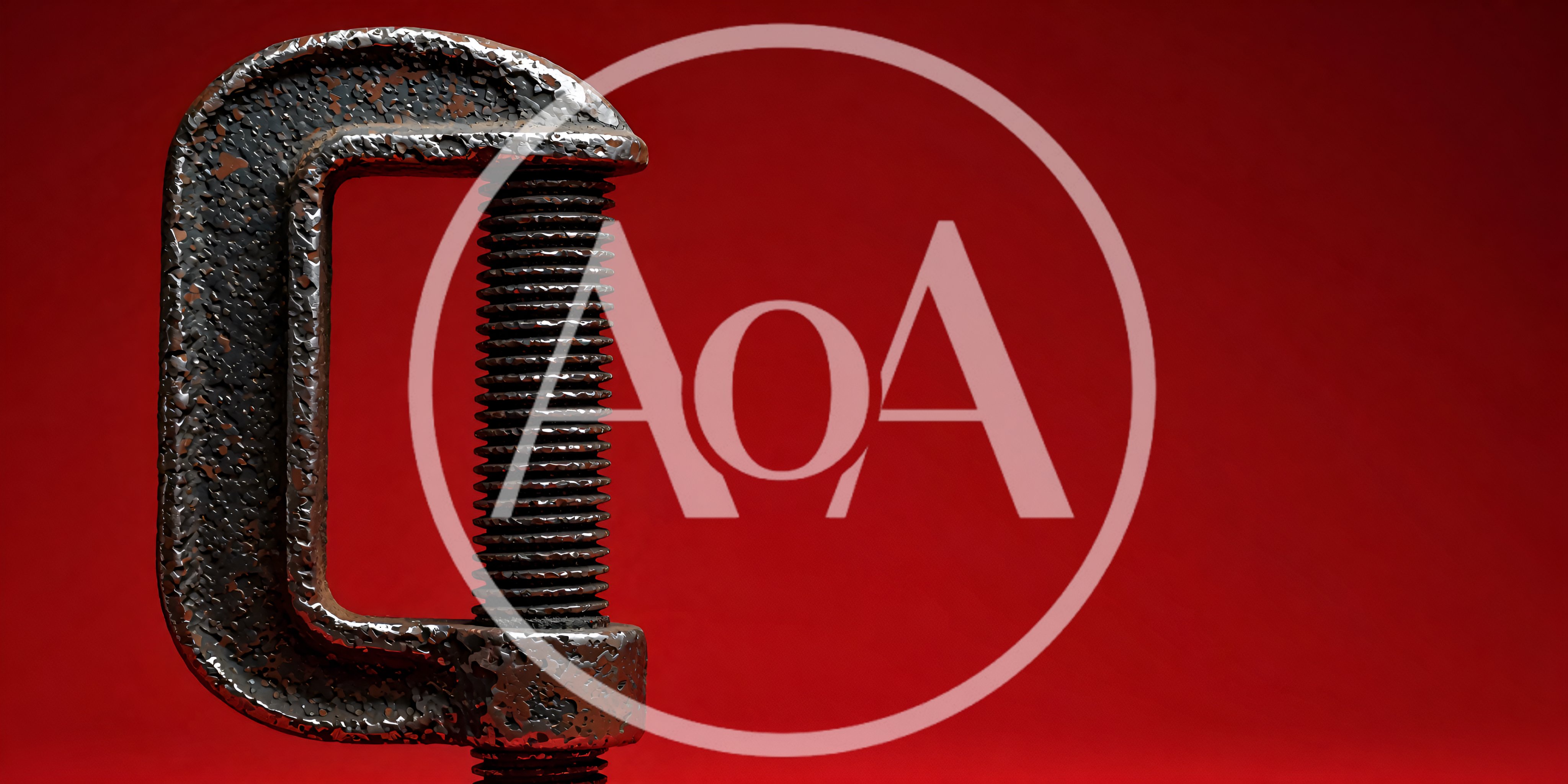 Close Up Of A Metal C-Clamp On Red Background