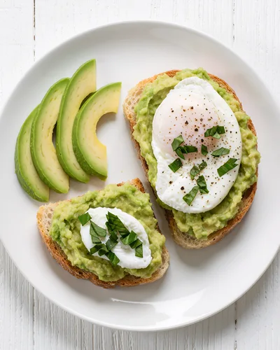 Avocado Toast With Poached Eggs On A White Plate