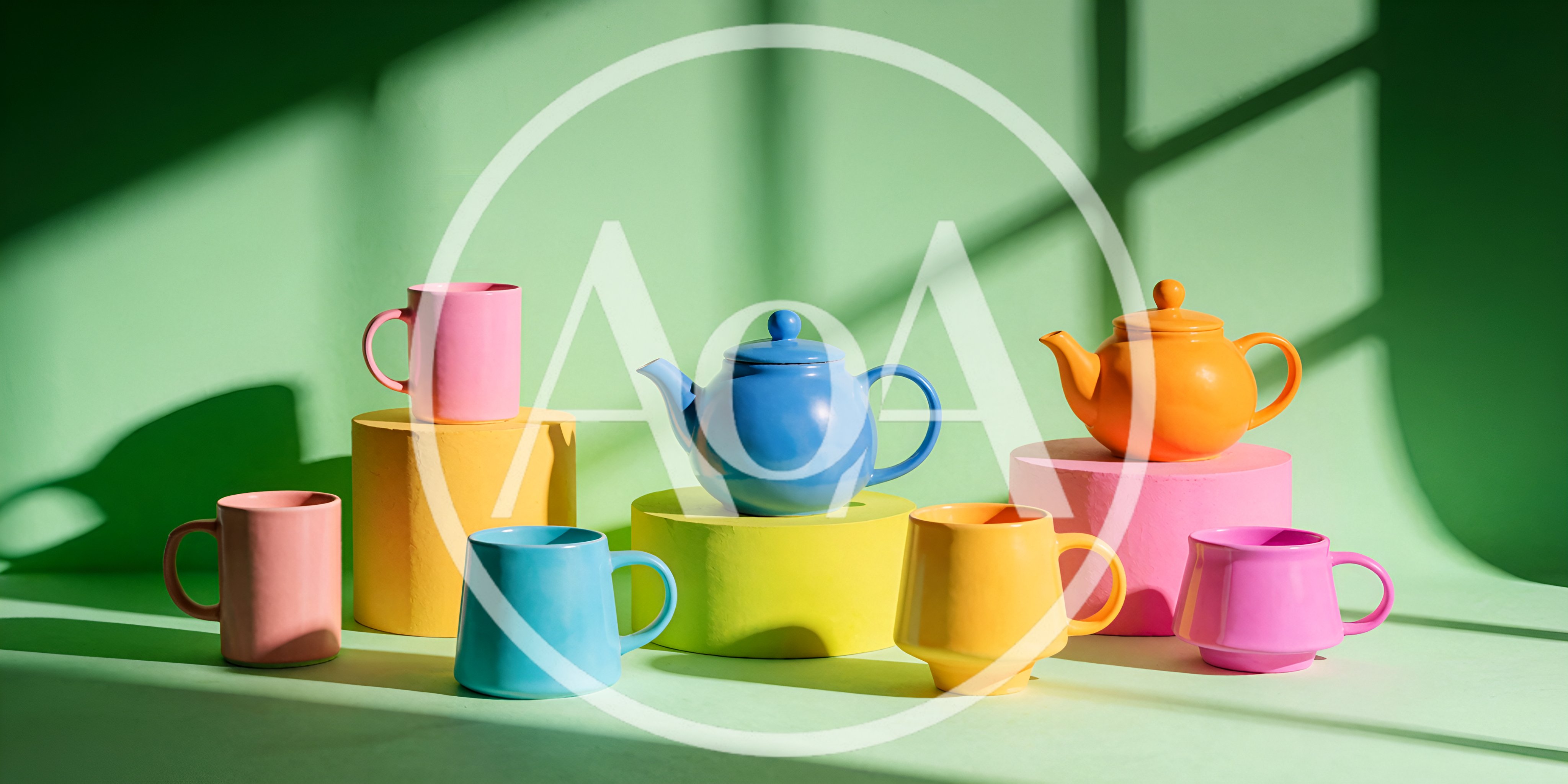 Colorful Ceramic Teapots and Mugs on Pedestals