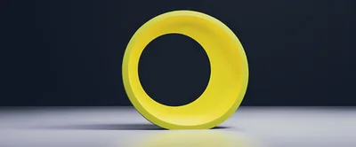 Yellow Circular Abstract Sculpture On A Grey Surface