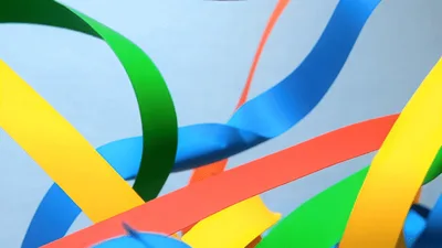 Colorful Ribbons Floating Against A Light Blue Background