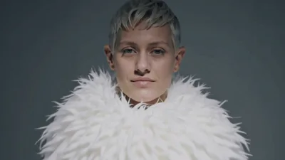 Androgynous Person With Short Blonde Hair Smiling