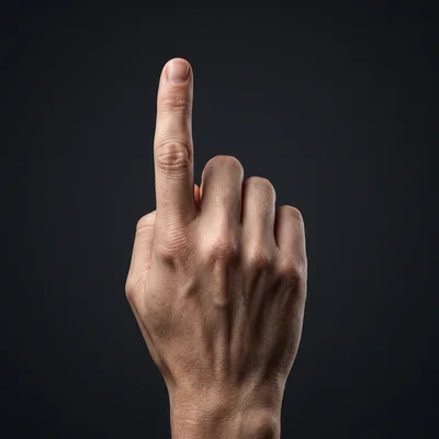Human Hand Pointing Upward Against Dark Background