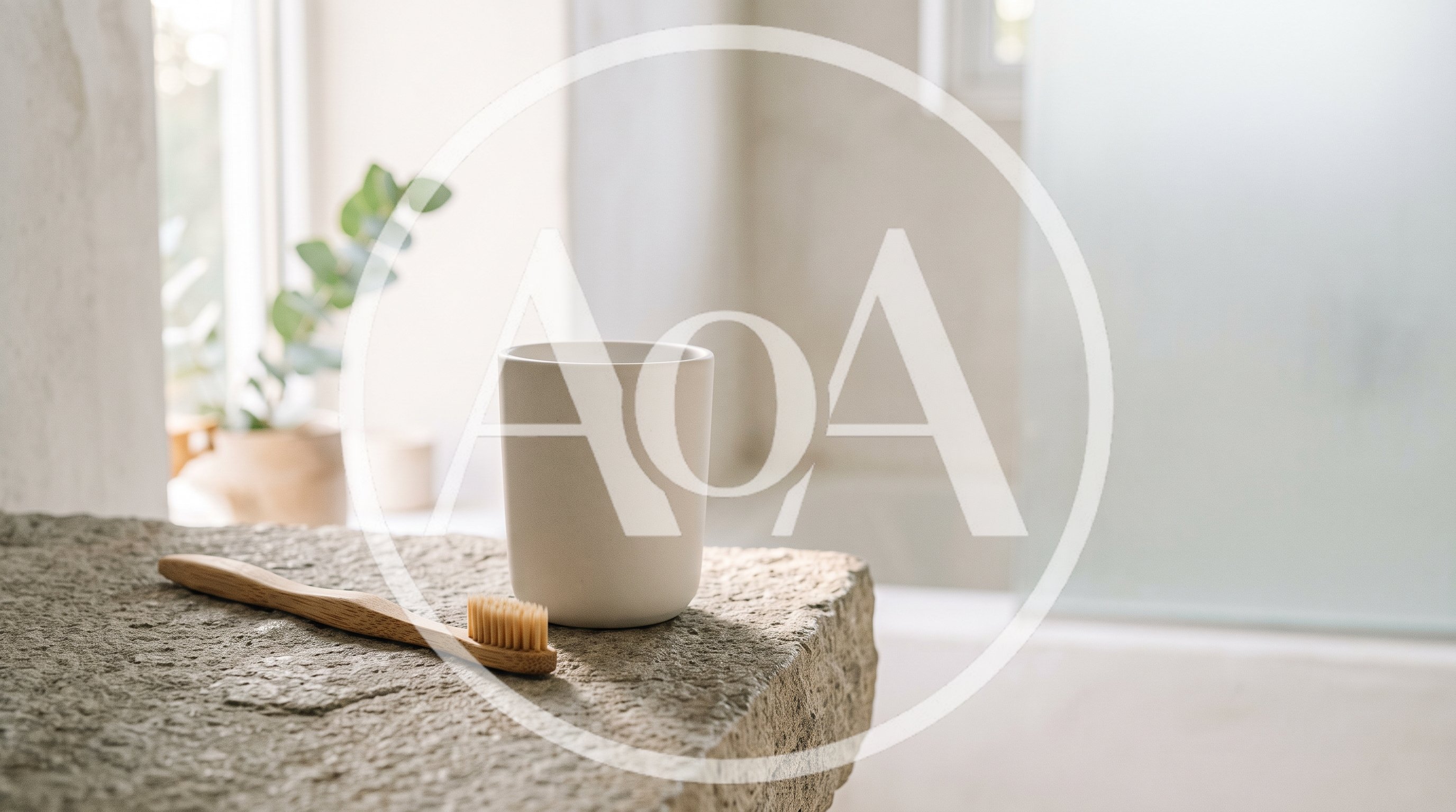 Bamboo Toothbrush And Ceramic Cup On Stone Countertop