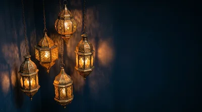 Hanging Moroccan Style Lanterns Against Dark Blue Wall