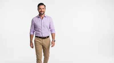 Confident Man Walking Toward Camera In Studio