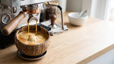 Espresso Pouring Into A Coconut Shell Bowl