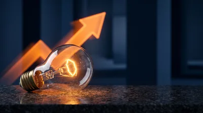 Glowing Light Bulb With Rising Orange Arrow
