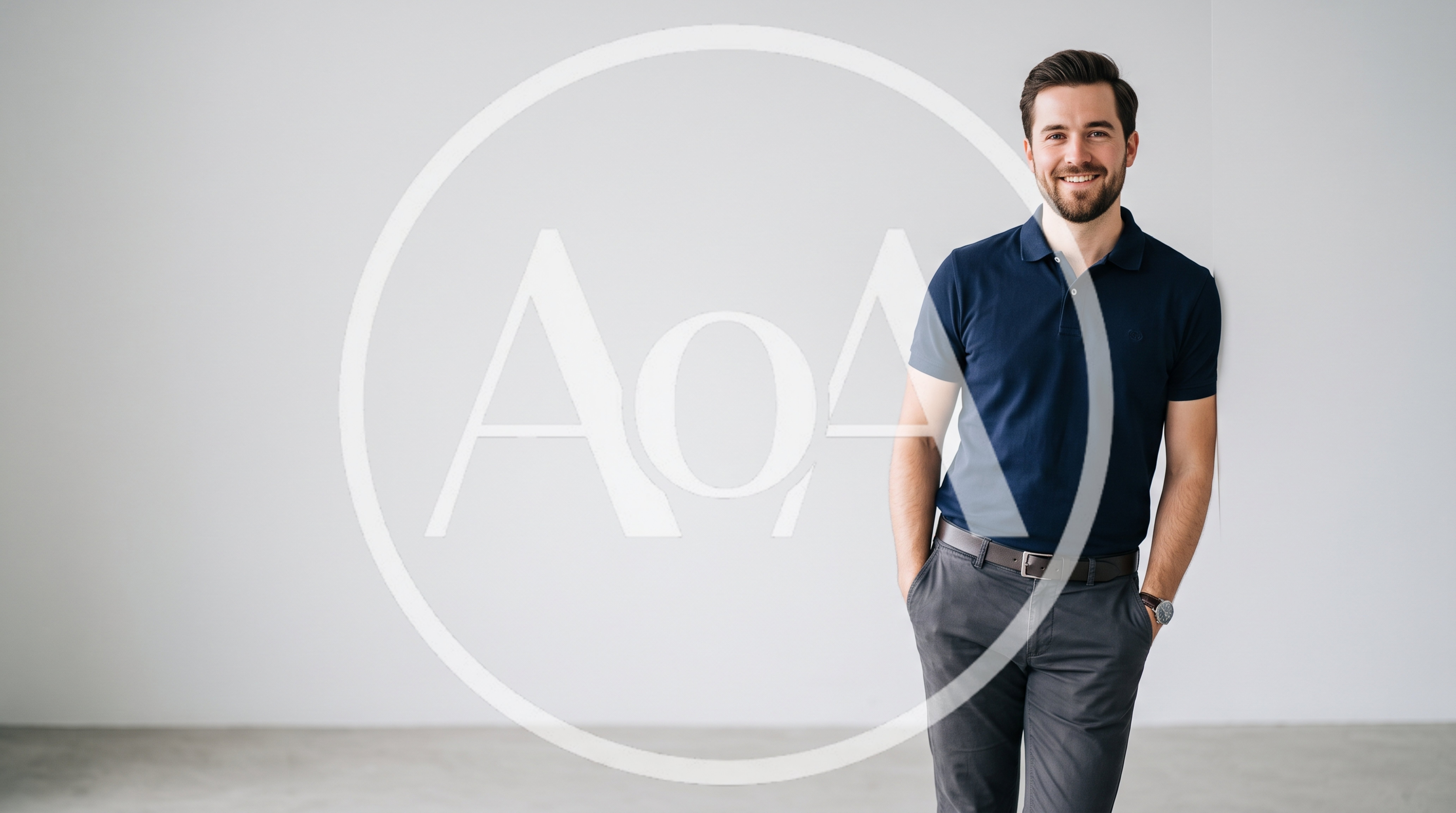 Smiling Man Standing Against A Plain White Wall