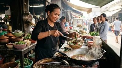 Street Food Vendor Preparing Traditional Noodle Soup