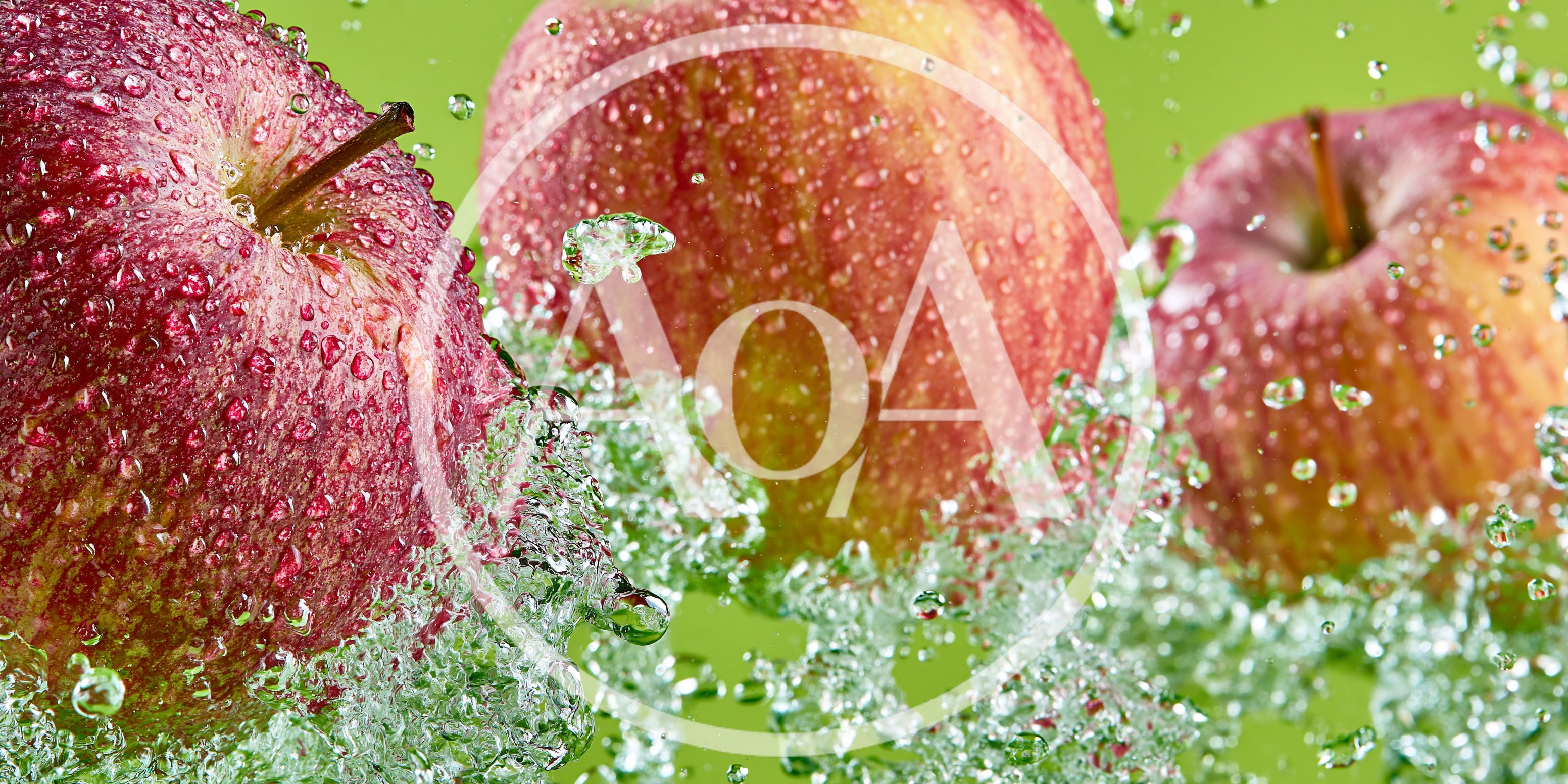 Three Fresh Red Apples Splashing In Water
