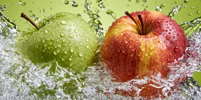 Green and Red Apples Splashing in Water