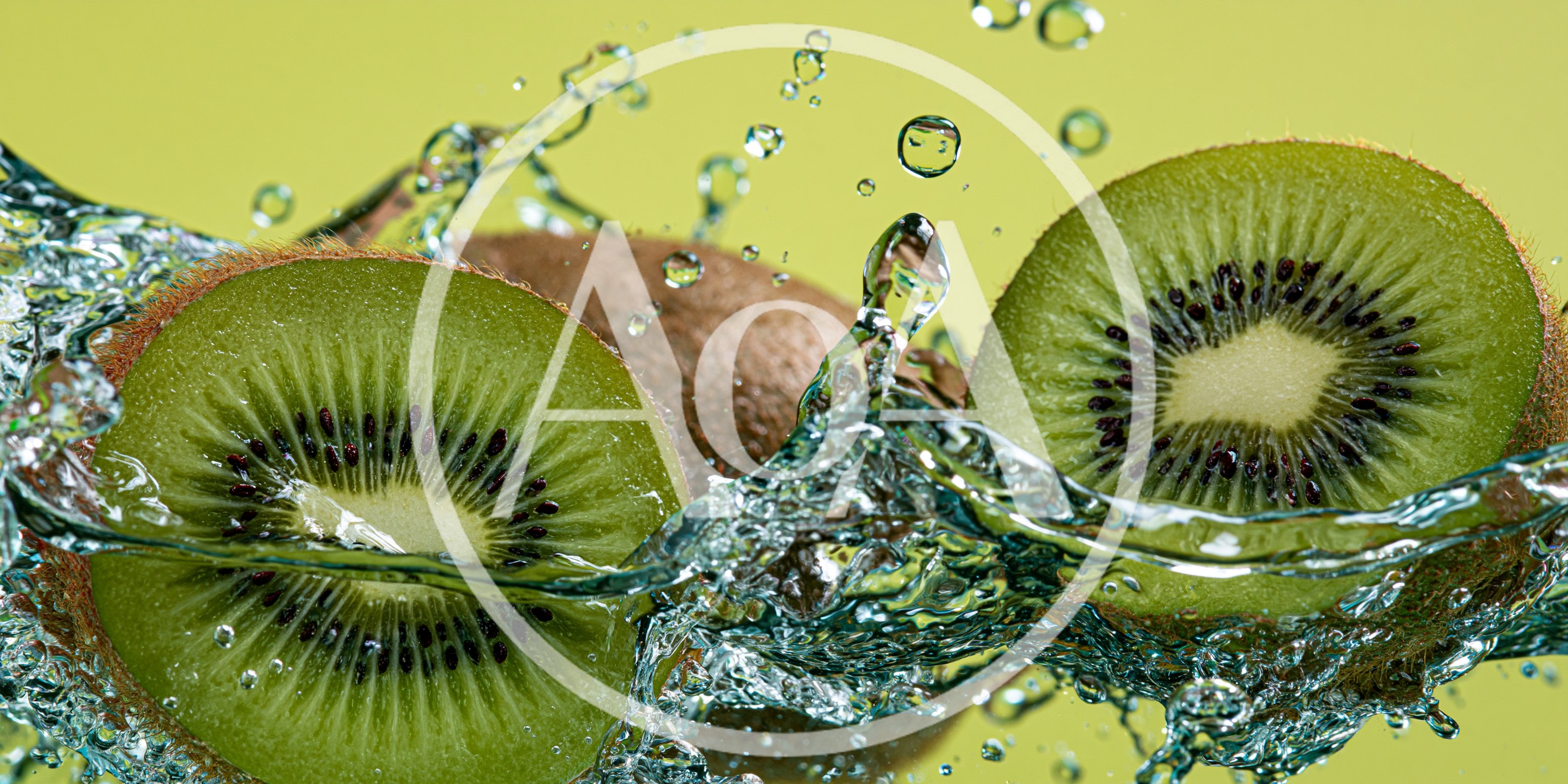 Fresh Kiwi Fruit Slices Splashing In Clear Water