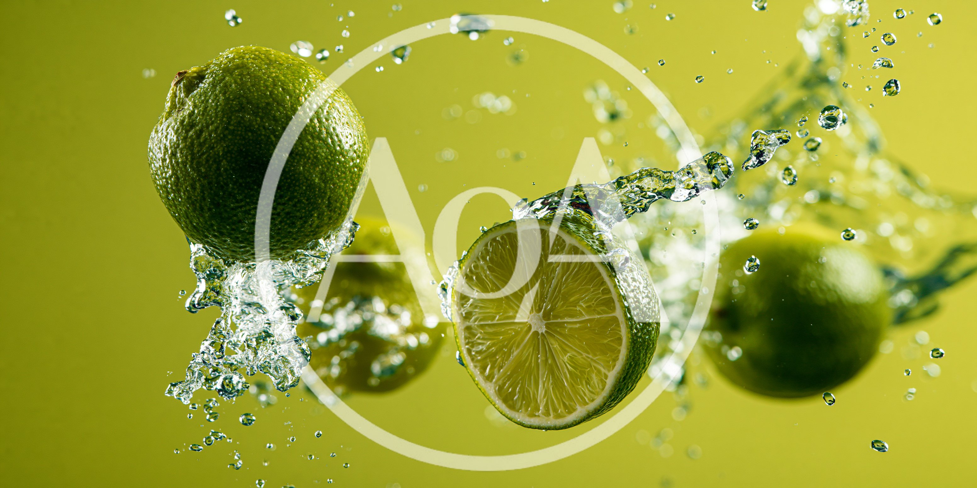 Fresh Limes Splashing in Water