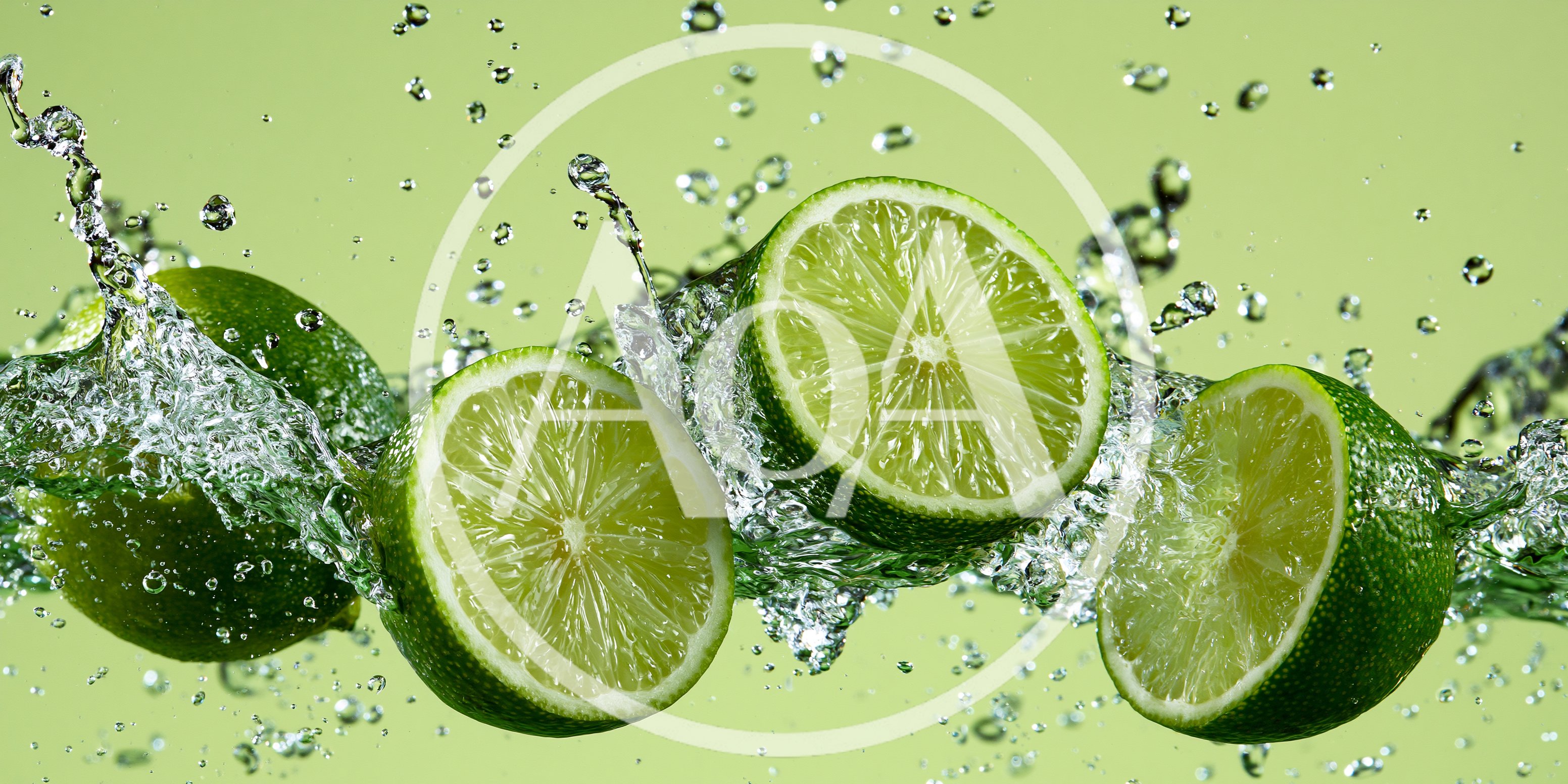 Fresh Lime Halves Splashing In Clear Water
