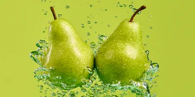 Two Fresh Green Pears Splashing In Water