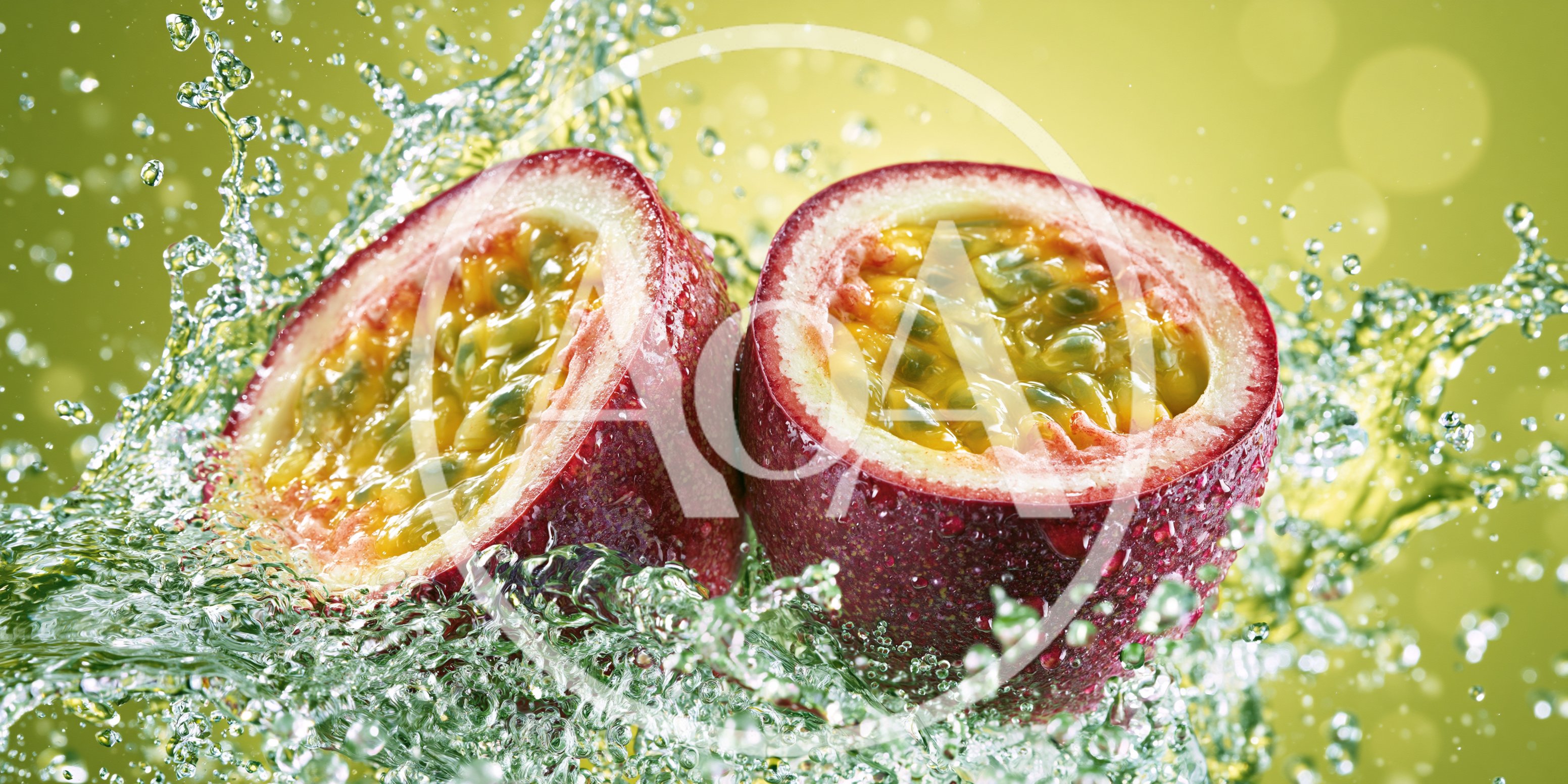 Two Halves of Fresh Passion Fruit Splashing in Water