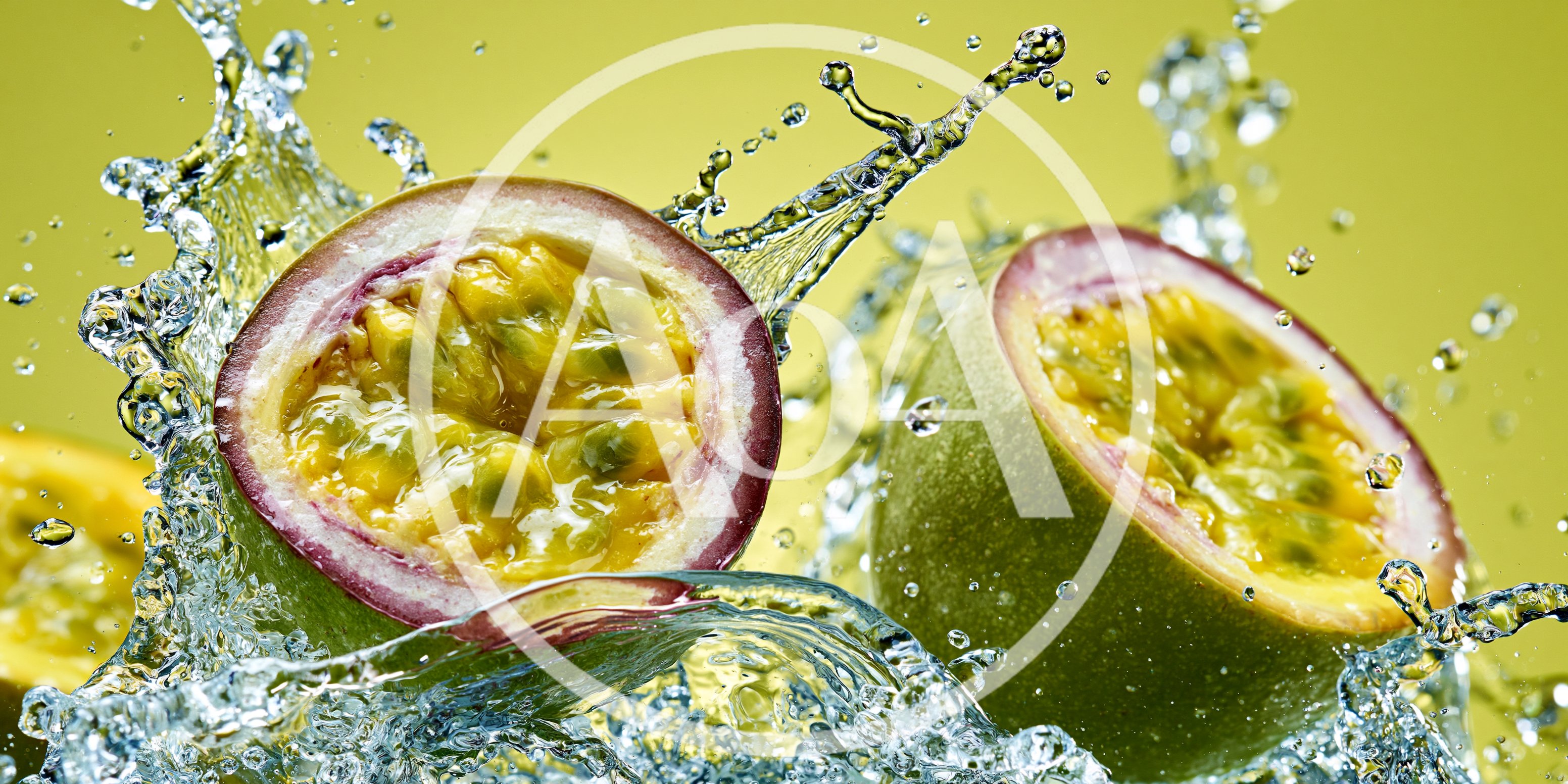 Fresh Passion Fruit Halves Splashing In Water