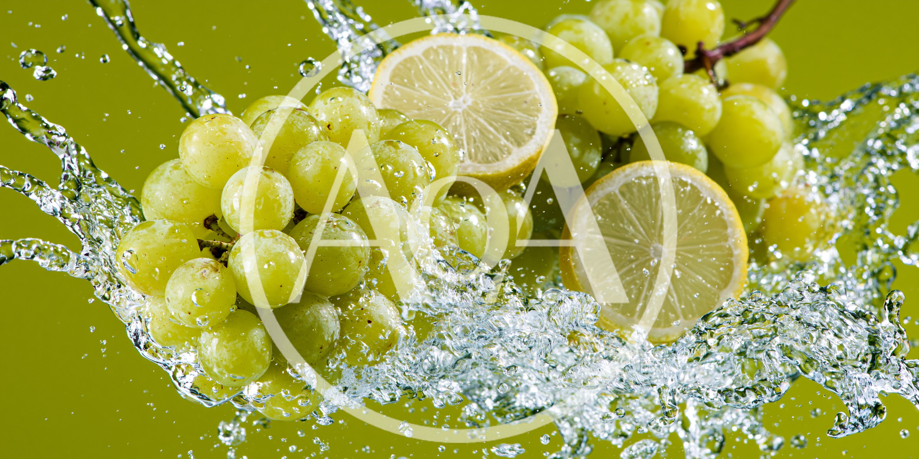 Green Grapes and Lemon Slices Splashing in Water