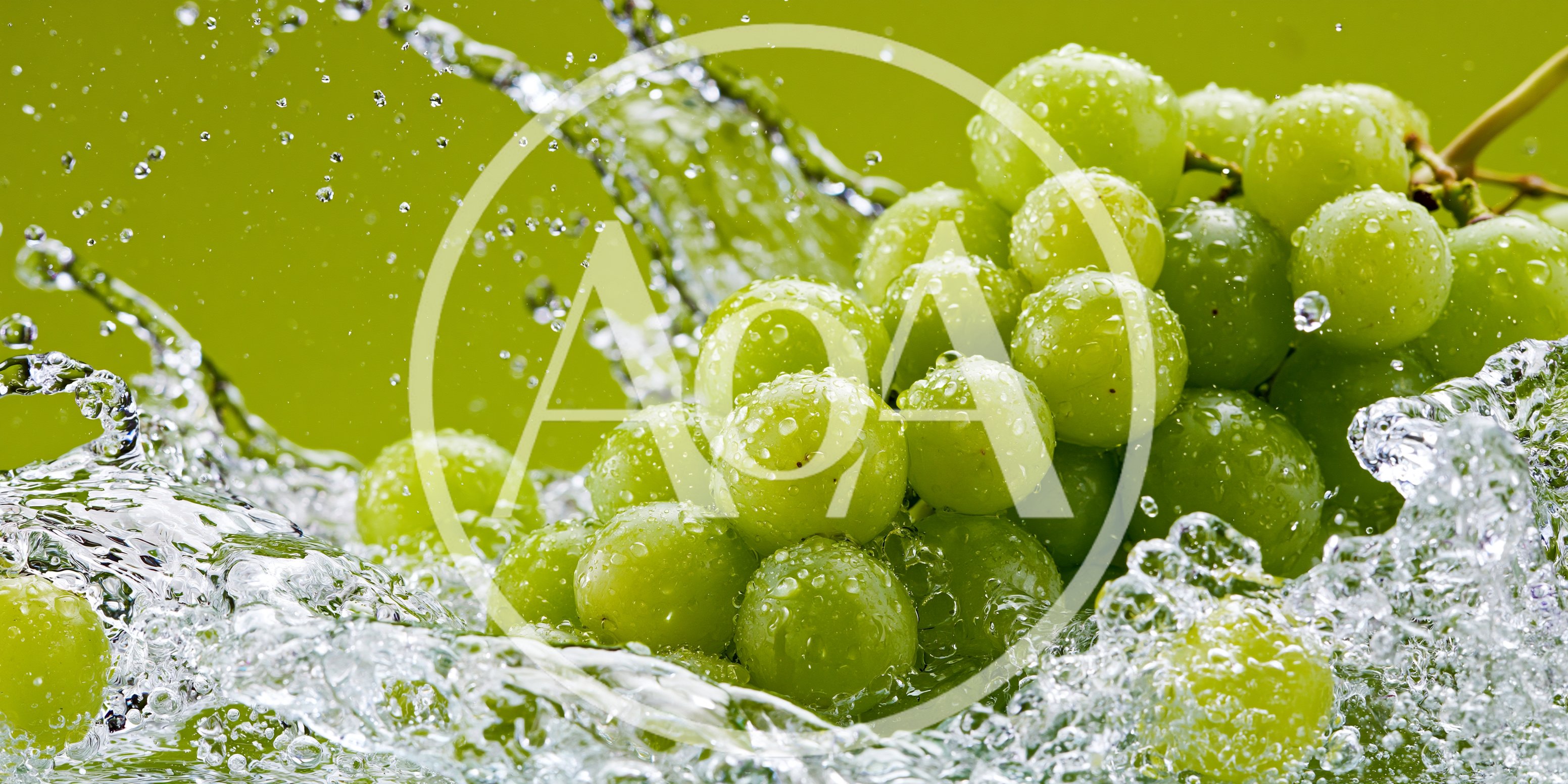 Fresh Green Grapes Splashing In Clear Water