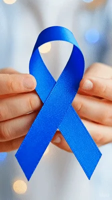 Person Holding Blue Awareness Ribbon In Hands