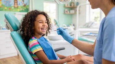 Young Girl Smiling During Dental Checkup