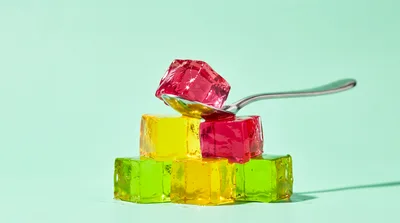 Colorful Gelatin Cubes Stacked on a Spoon