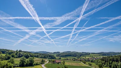 Contrail Grid Over Rural German Landscape