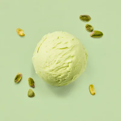 Single Scoop Of Pistachio Ice Cream With Nuts